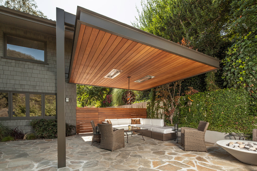 Inspiration for a contemporary patio in Los Angeles with a fire feature.