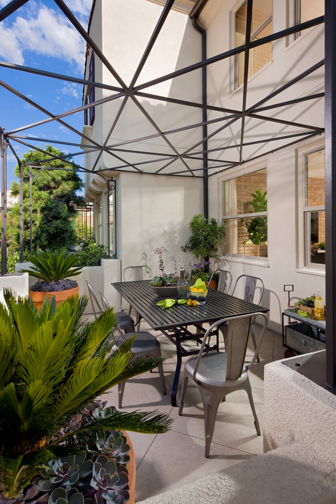 Contemporary patio in Orange County with a pergola.