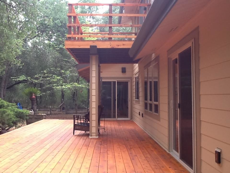 Photo of a large rustic back patio in Sacramento with decking and a roof extension.