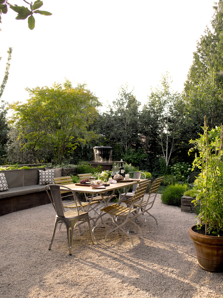Trendy gravel patio photo in Seattle with no cover