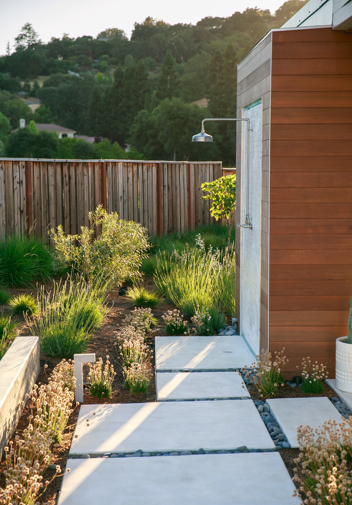 This is an example of a contemporary patio in San Francisco with an outdoor shower.