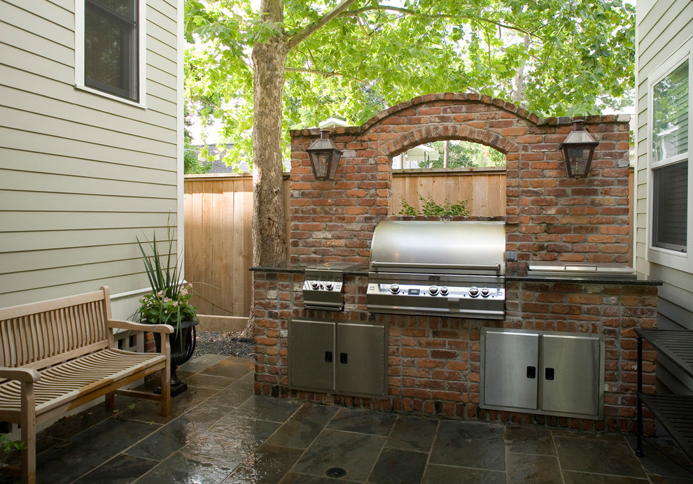 This is an example of a classic patio in Houston with a bbq area.