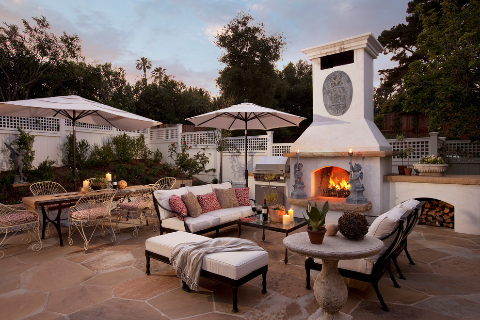 This is an example of a classic patio in Santa Barbara with a fire feature.