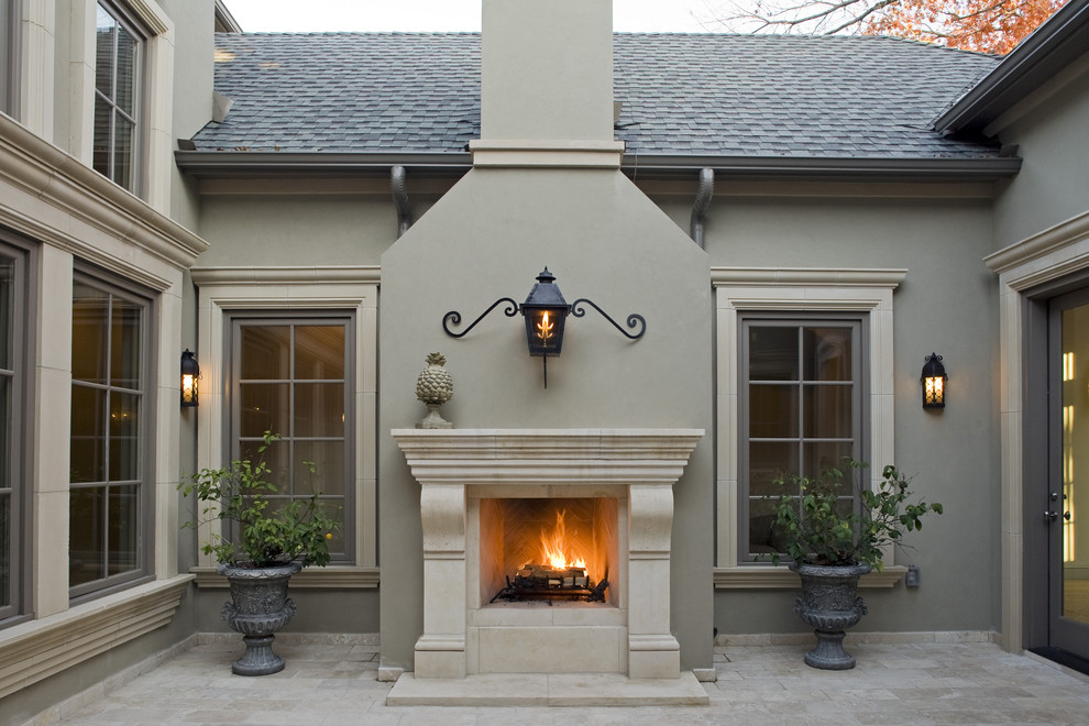 Inspiration for a mediterranean courtyard patio remodel in Dallas with a fire pit