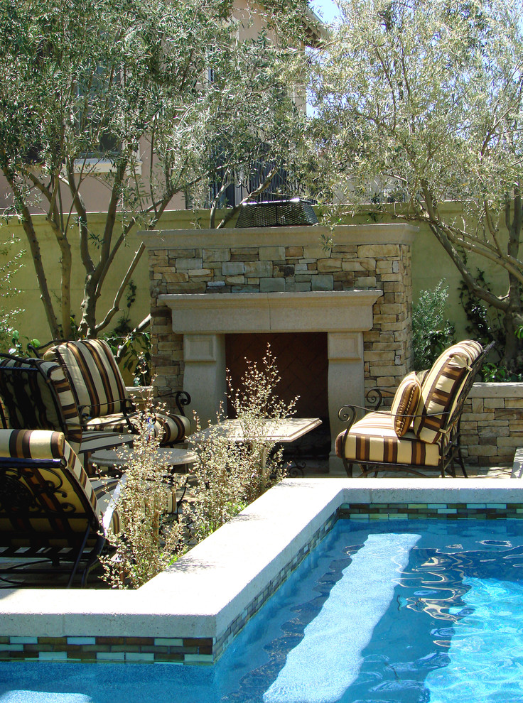 Patio - mediterranean patio idea in Los Angeles with a fire pit