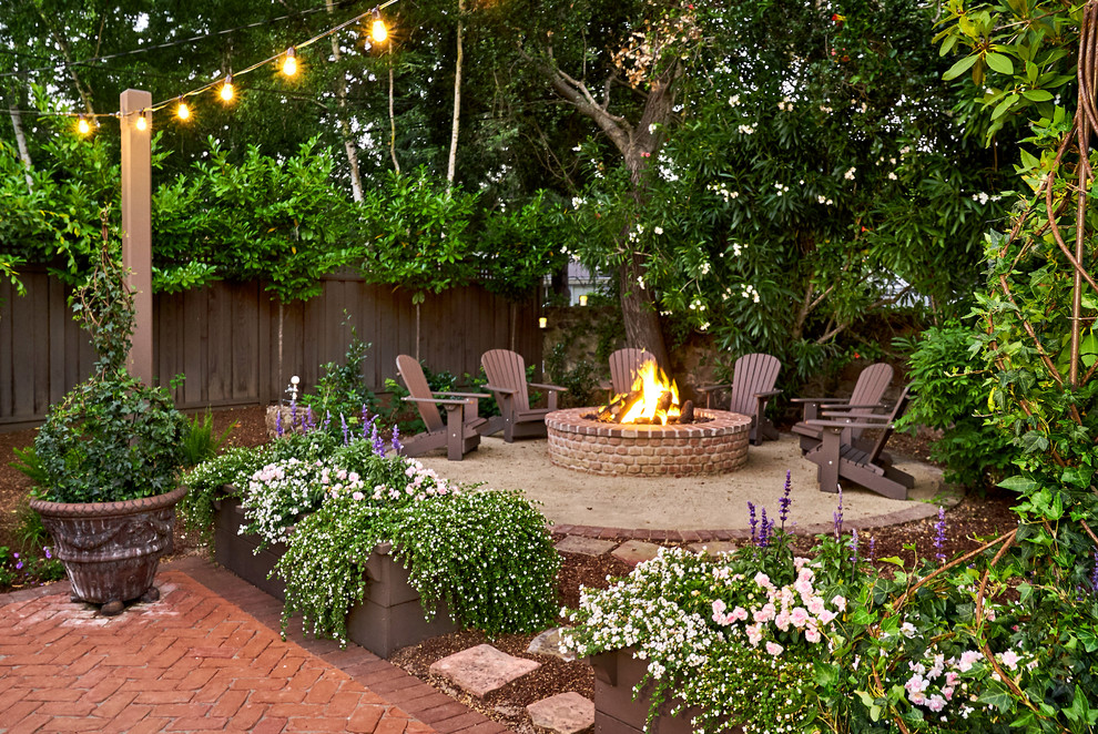 Patio - huge traditional backyard brick patio idea in San Francisco with a fire pit and a pergola