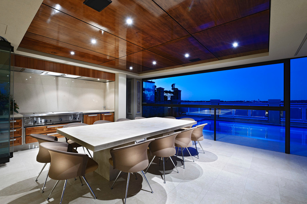 This is an example of a contemporary patio in Perth with a roof extension and a bbq area.