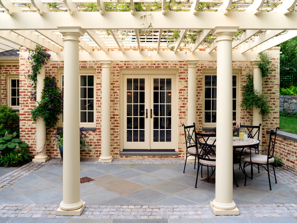 Photo of a traditional patio in DC Metro with a pergola.