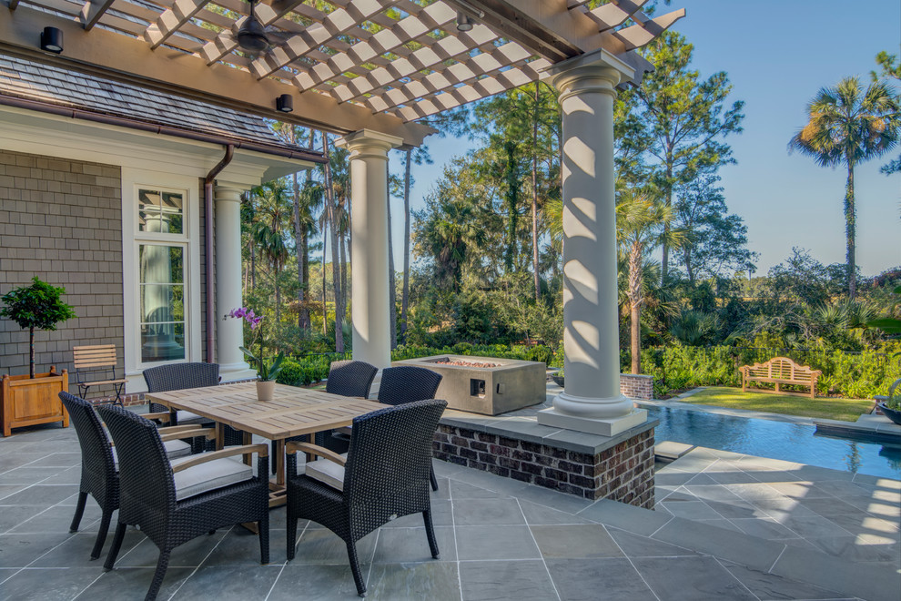 Inspiration for a timeless tile patio remodel in Charlotte with a pergola