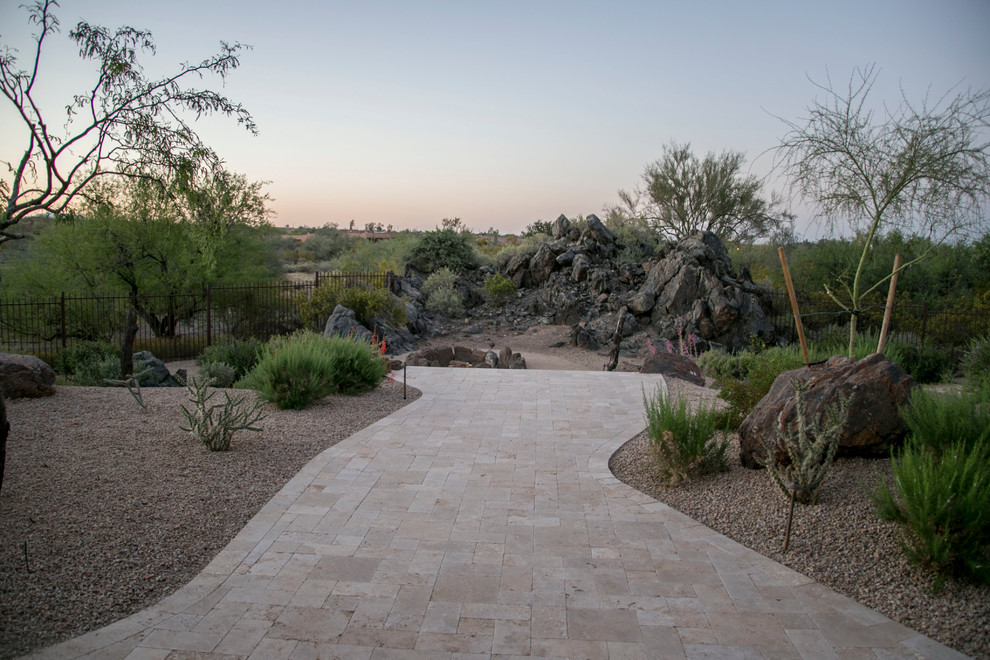 Inspiration for a large southwestern backyard concrete paver patio kitchen remodel in Phoenix with a gazebo