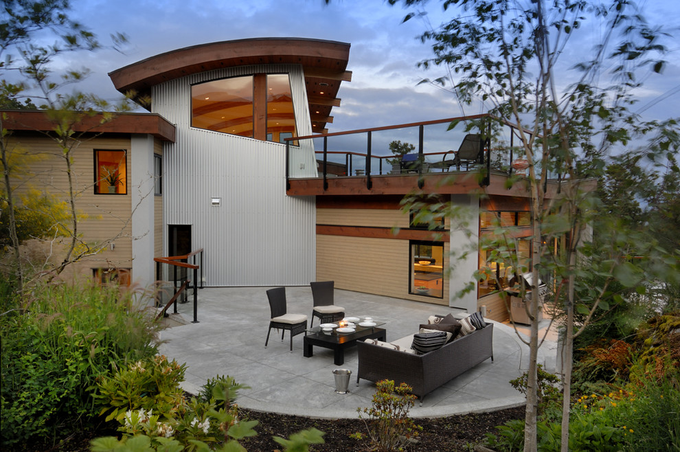 Inspiration for a contemporary patio in Vancouver with stamped concrete.