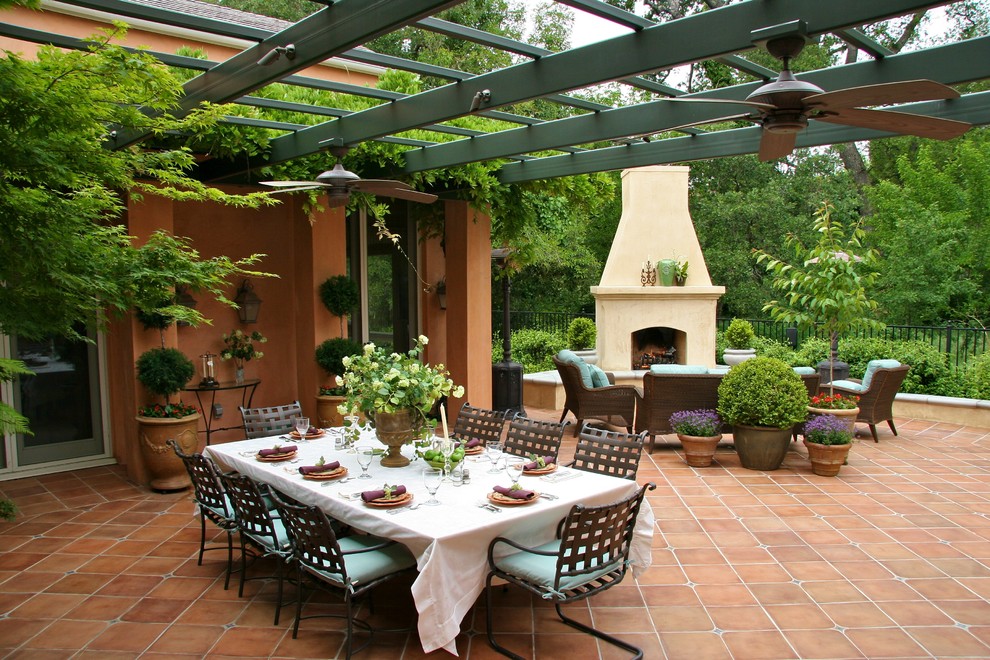 Tuscan patio photo in Sacramento with a fire pit and a pergola