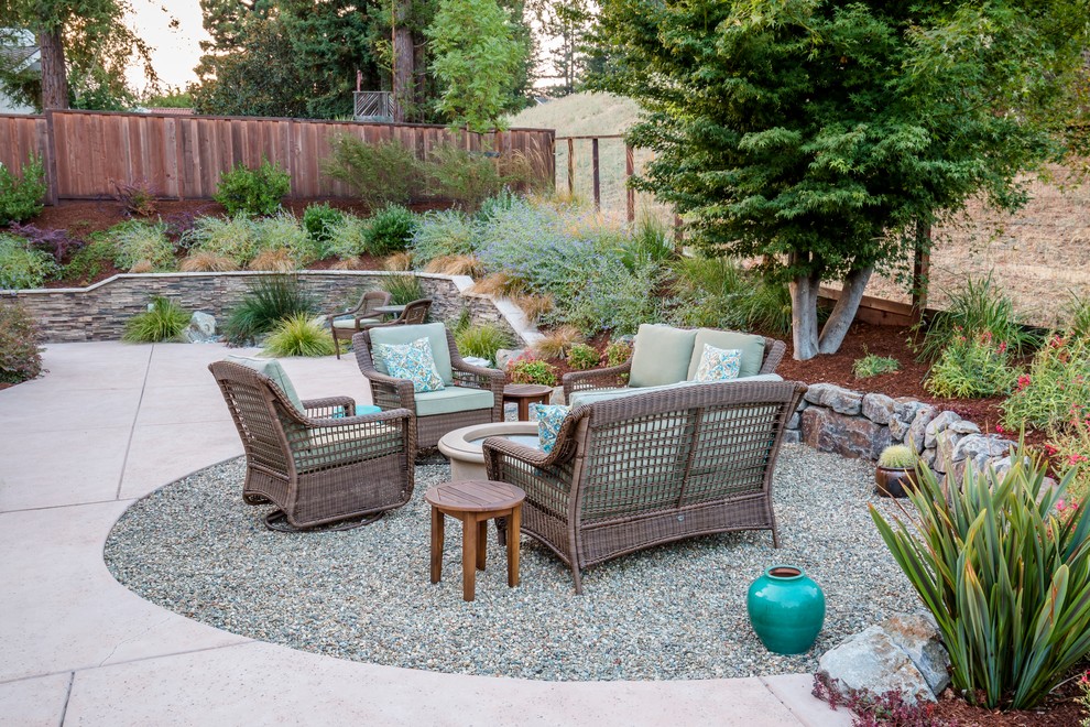Inspiration for a large classic back patio in San Francisco with a fire feature, concrete slabs and no cover.