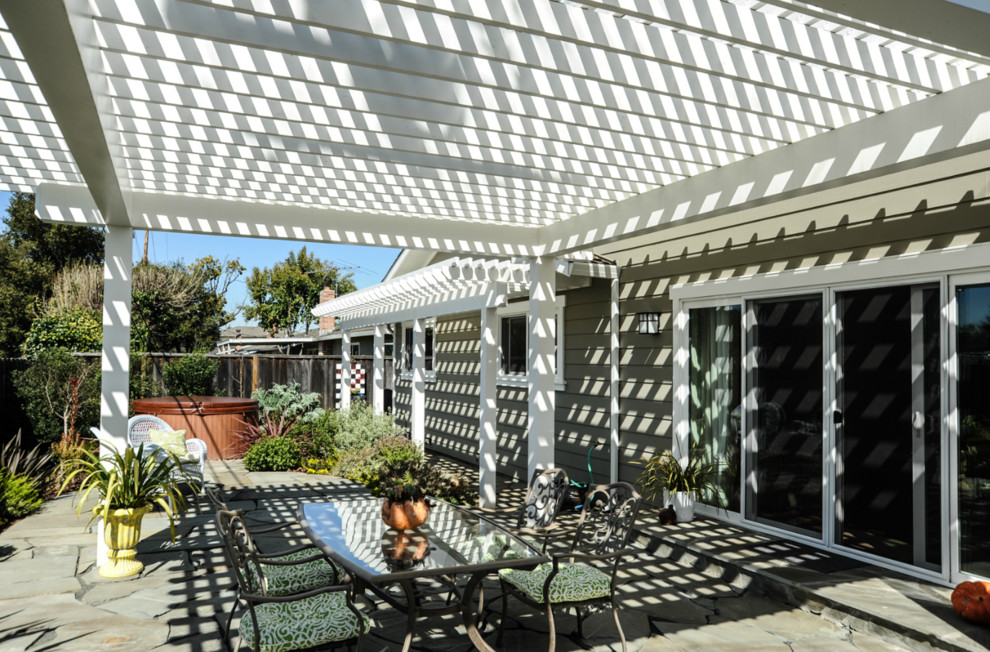 Design ideas for a medium sized classic back patio in San Francisco with natural stone paving and a pergola.