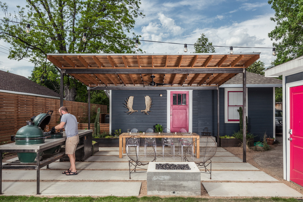 Patio kitchen - contemporary backyard concrete paver patio kitchen idea in Houston