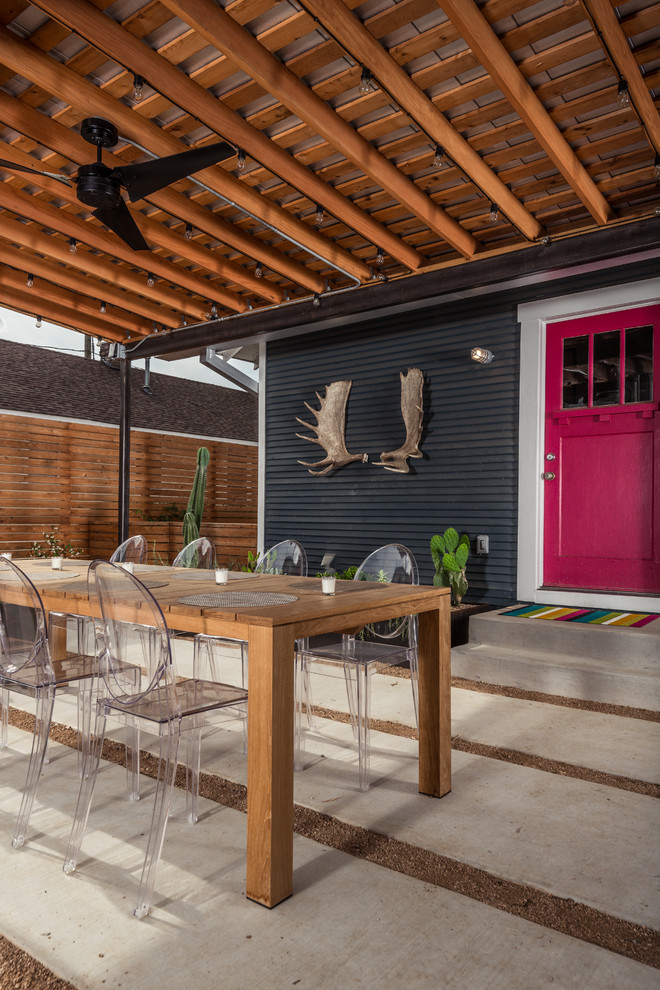 Patio kitchen - contemporary backyard concrete paver patio kitchen idea in Houston with a roof extension