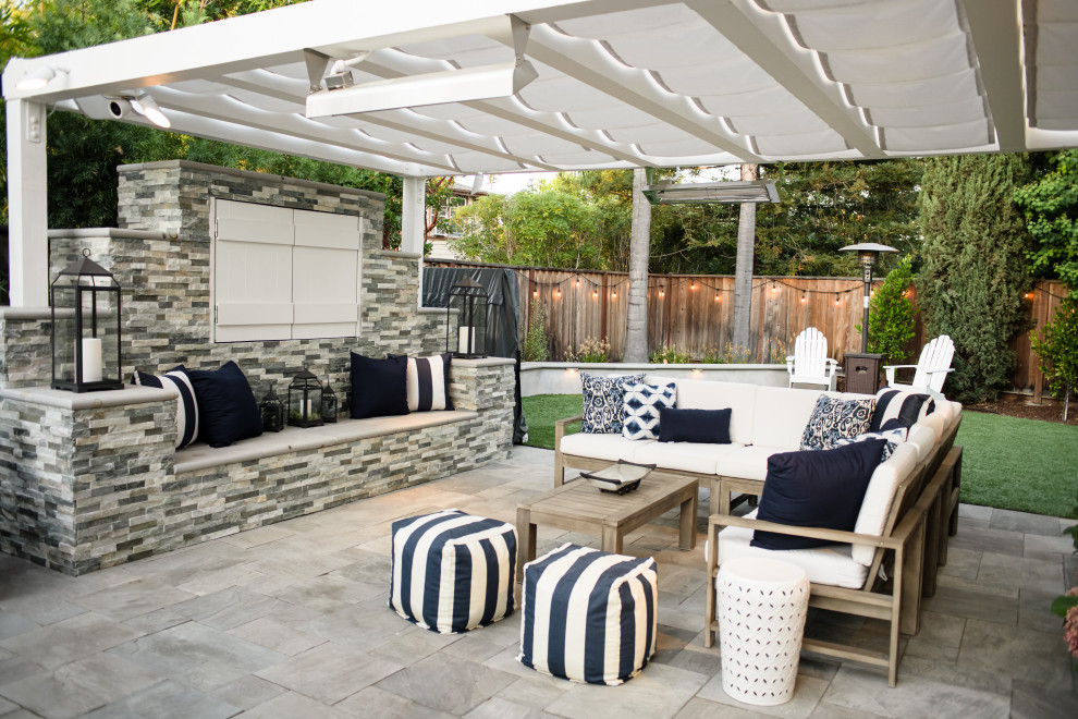 Classic back patio in San Francisco with concrete paving and a pergola.
