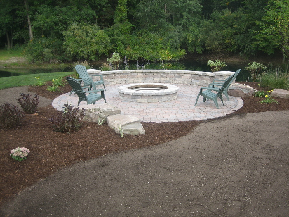 Backyard circle patio Traditional Patio Grand Rapids by