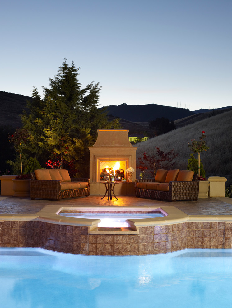 Example of a large classic backyard patio design in San Francisco with a fire pit and no cover