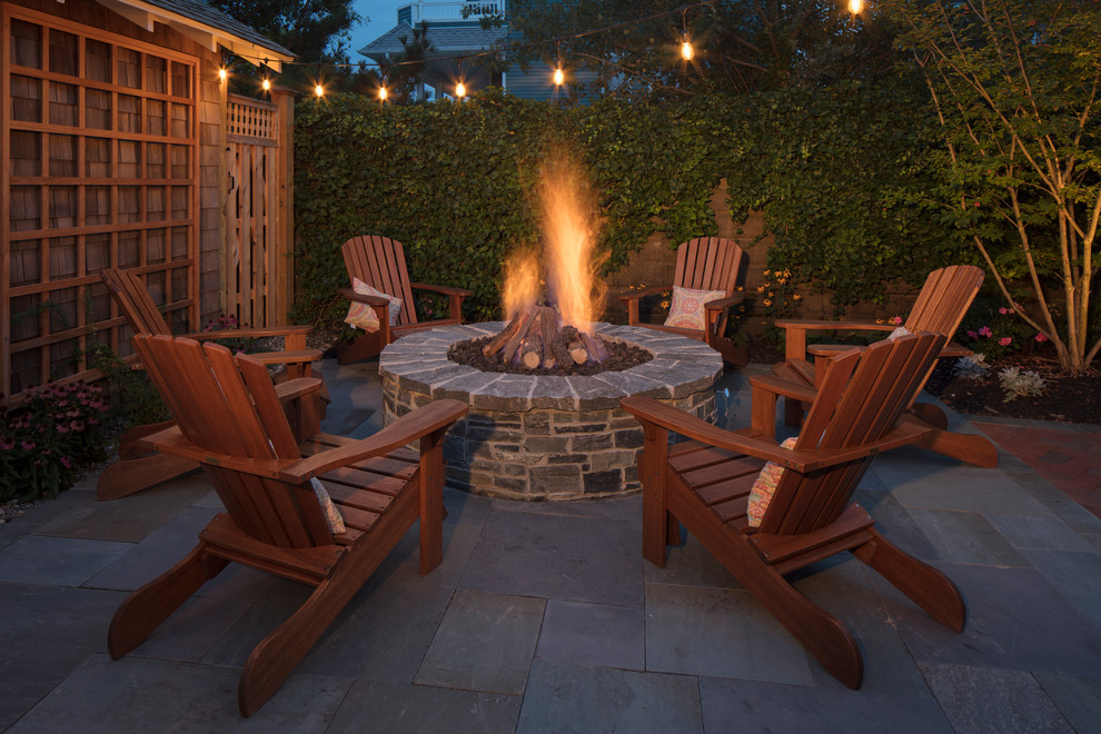 Mid-sized elegant backyard brick patio photo in Philadelphia with a fire pit and no cover