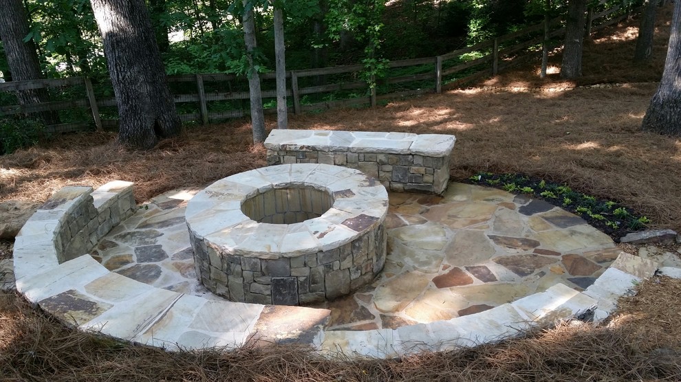 Inspiration for a contemporary back patio in Atlanta with a fire feature, stamped concrete and no cover.