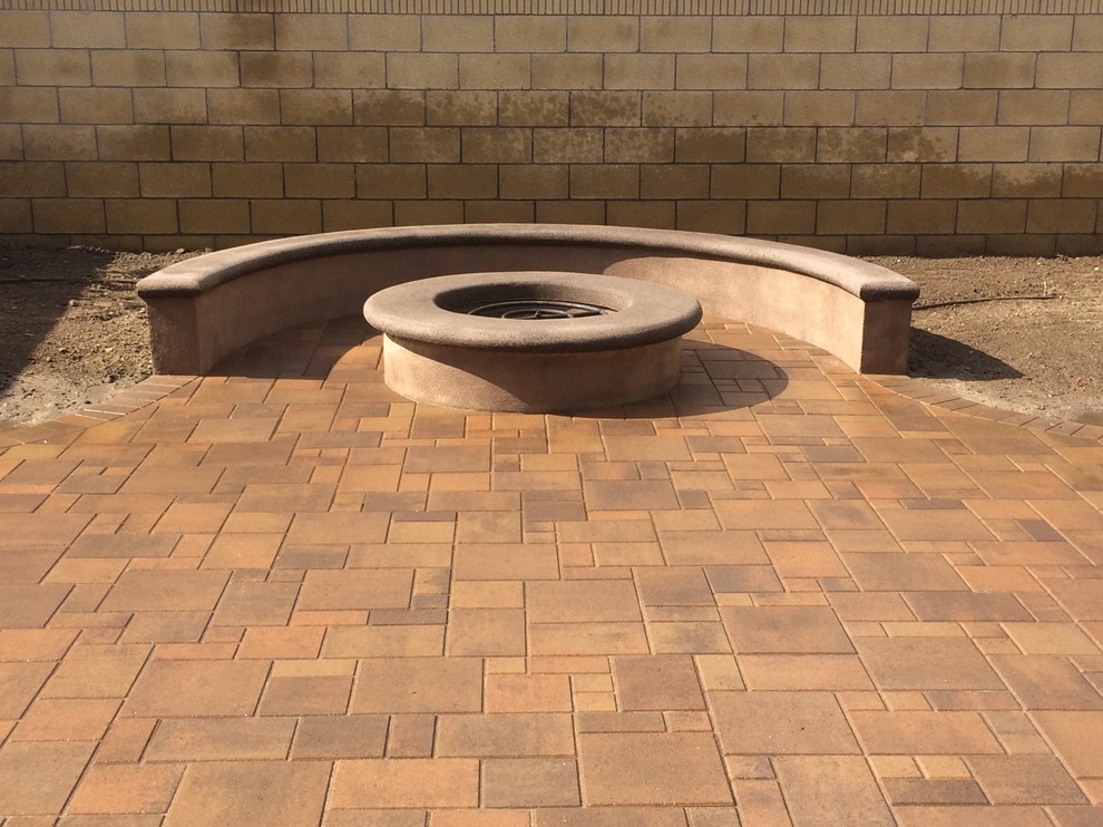 Design ideas for a medium sized rustic back patio in Los Angeles with a fire feature, concrete paving and no cover.