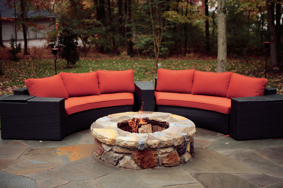 Design ideas for a large contemporary back patio in Wilmington with a fire feature.