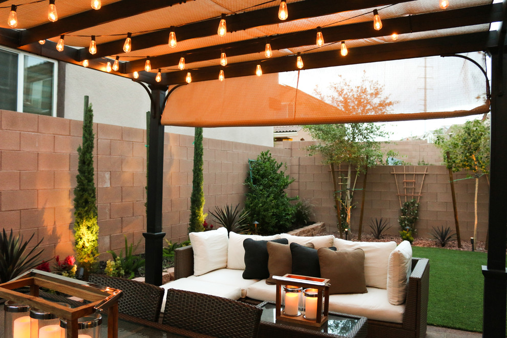 Design ideas for a small classic back patio in Las Vegas with concrete paving and a pergola.