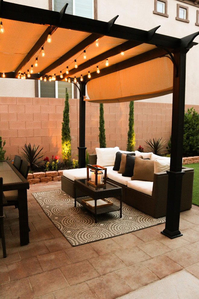 Photo of a small classic back patio in Las Vegas with concrete paving and a pergola.