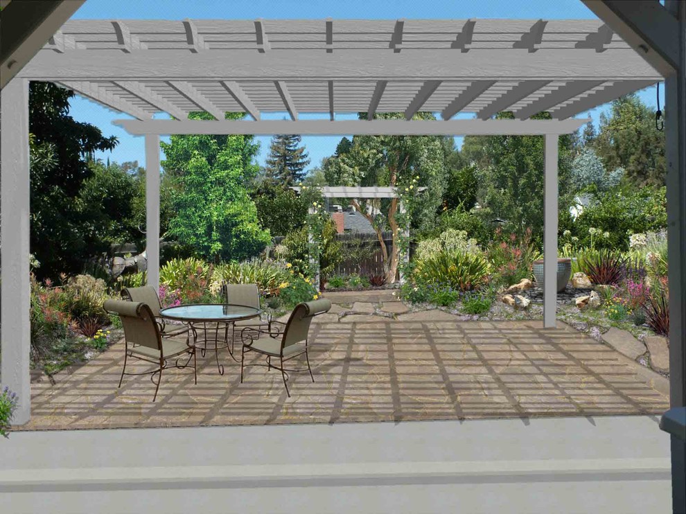 Design ideas for a medium sized traditional back patio in Santa Barbara with a water feature, natural stone paving and a pergola.