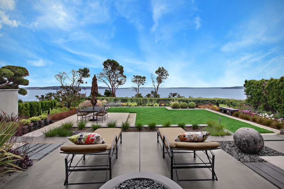 Patio - transitional backyard patio idea in Seattle with a fire pit