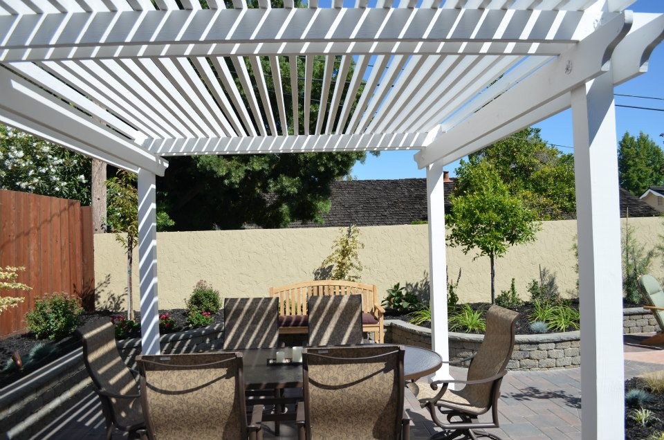 This is an example of a medium sized classic back patio in San Francisco with a pergola.