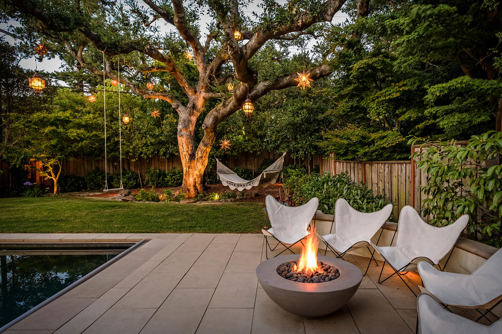 Photo of a mediterranean back patio in San Francisco with a fire feature and no cover.