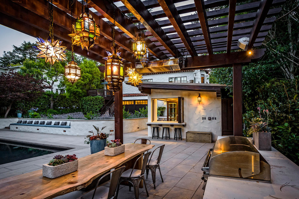 Inspiration for a mediterranean back patio in San Francisco with a pergola.