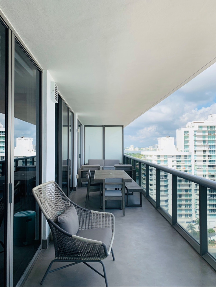 This is an example of a large contemporary balcony in Miami.