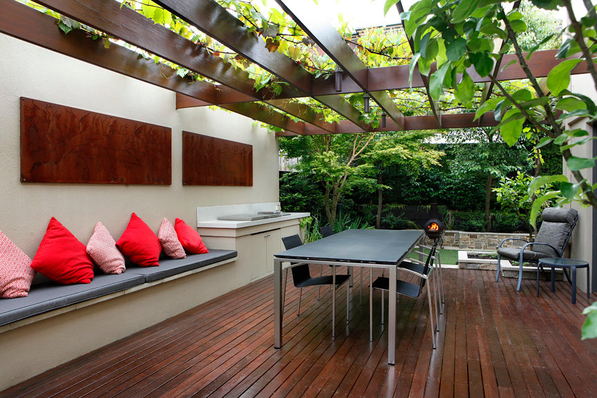 Small trendy backyard patio photo in Melbourne with decking
