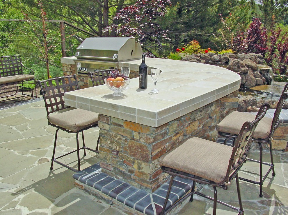 BBQ and pond with flagstone patio Rustic Patio San Francisco by