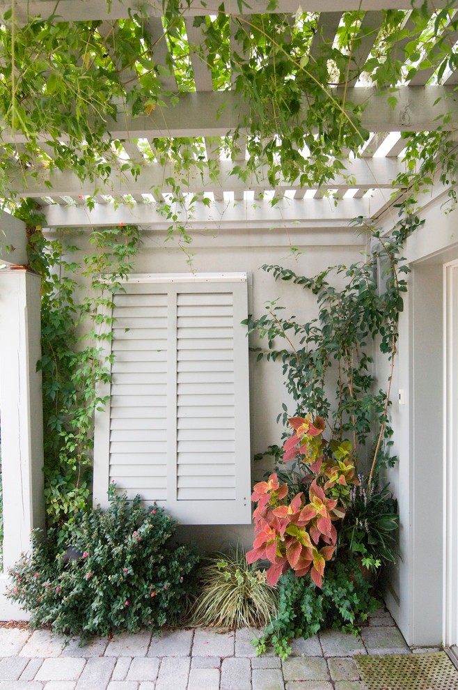 Design ideas for a traditional patio in Philadelphia with a pergola.