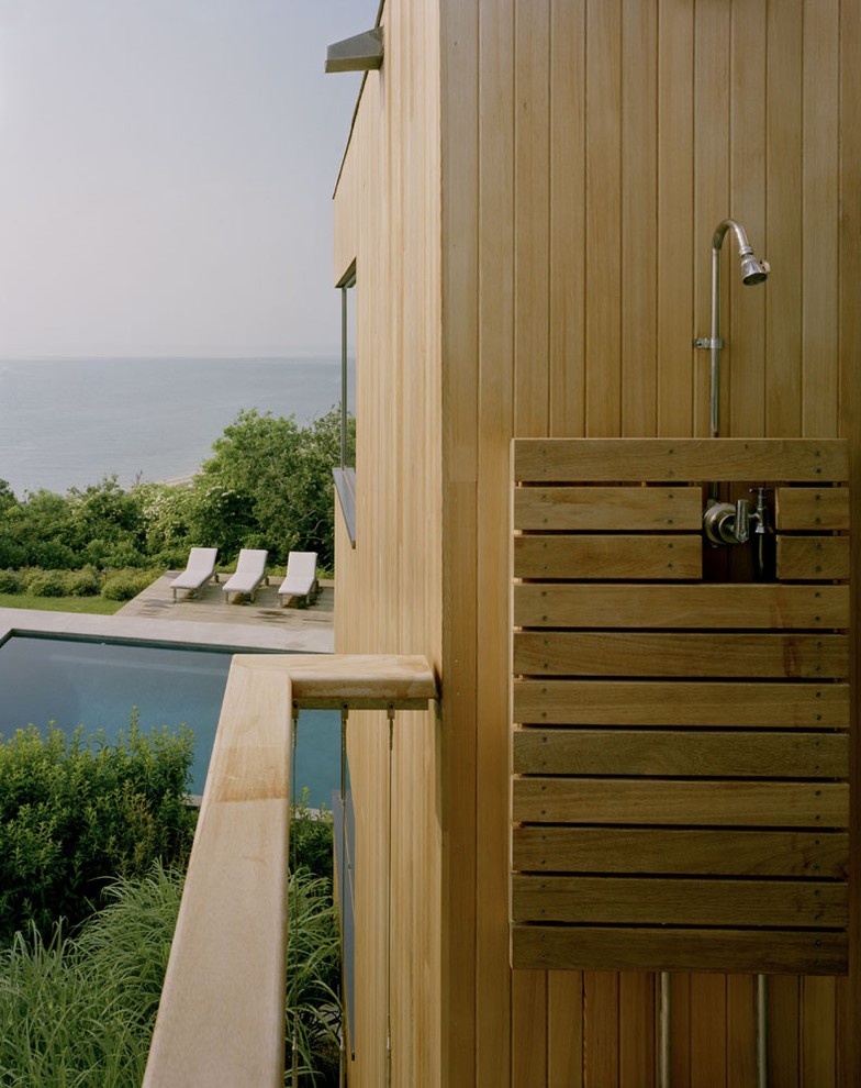 Photo of a coastal patio in New York with an outdoor shower.