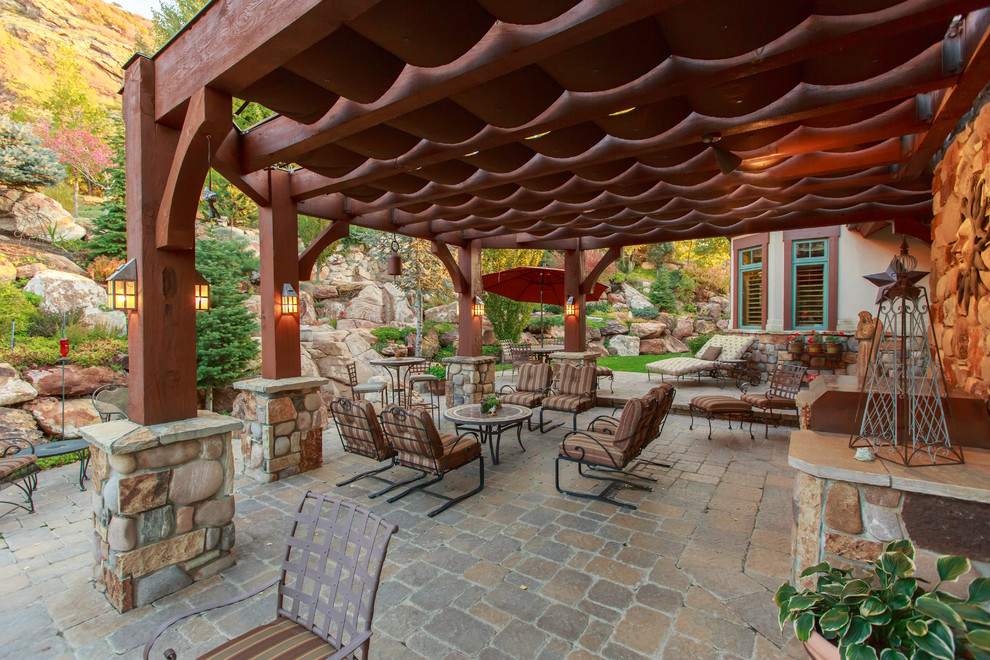 Inspiration for a rustic patio in Salt Lake City with a pergola.