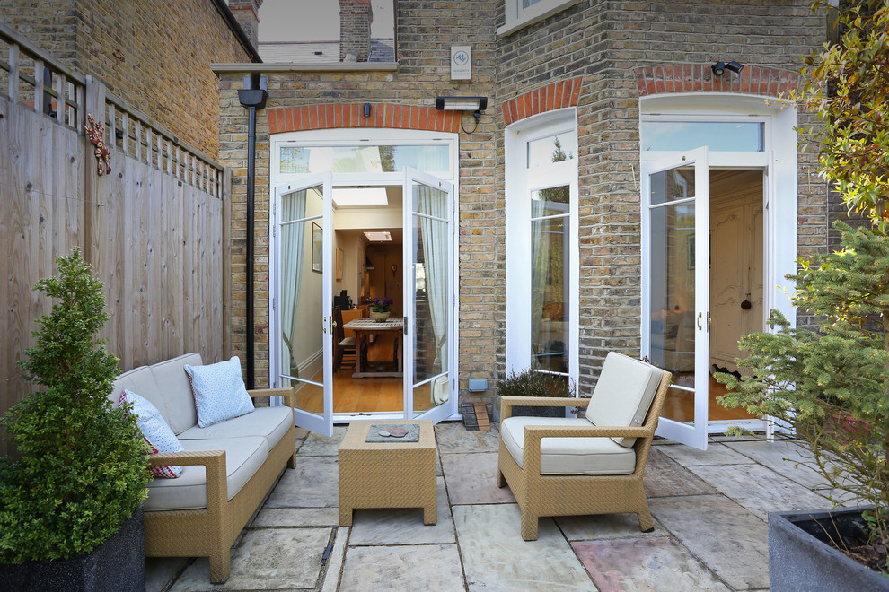 Design ideas for a traditional patio in London.