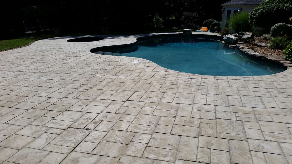 Design ideas for a traditional patio in Boston with stamped concrete.