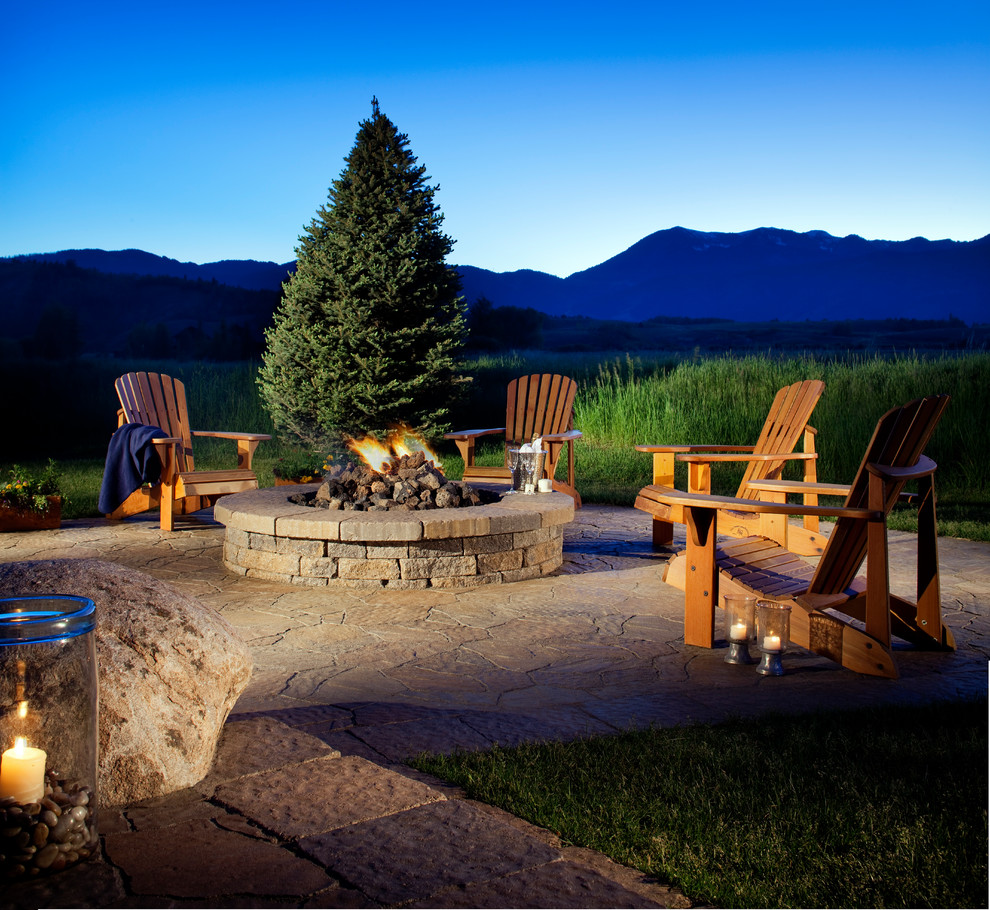 Inspiration for a mid-sized timeless backyard stone patio remodel in Oklahoma City with a fire pit and no cover