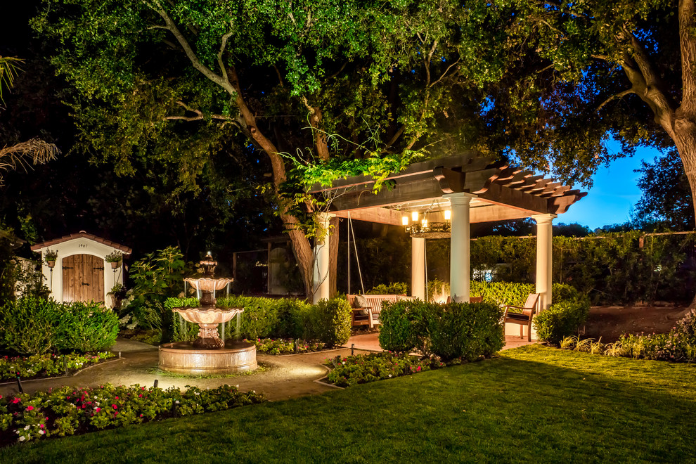 Patio fountain - large mediterranean brick patio fountain idea in San Francisco with a pergola