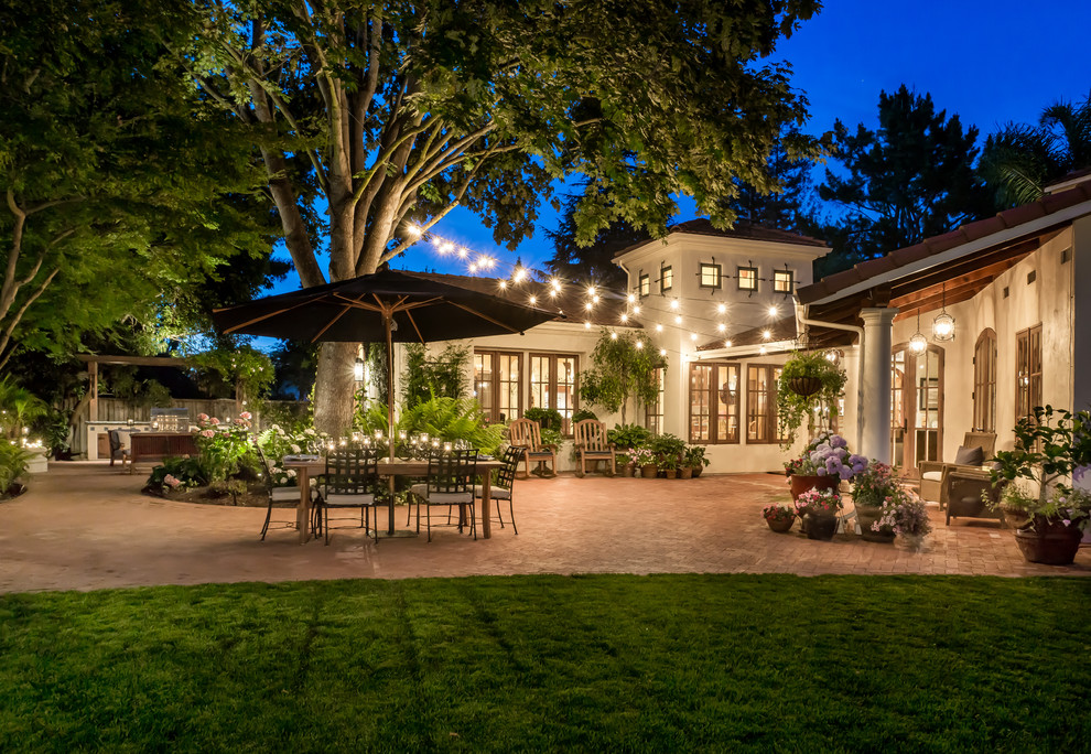 Large tuscan brick patio photo in San Francisco with no cover
