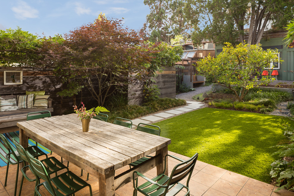 This is an example of a large classic back patio in San Francisco with no cover.
