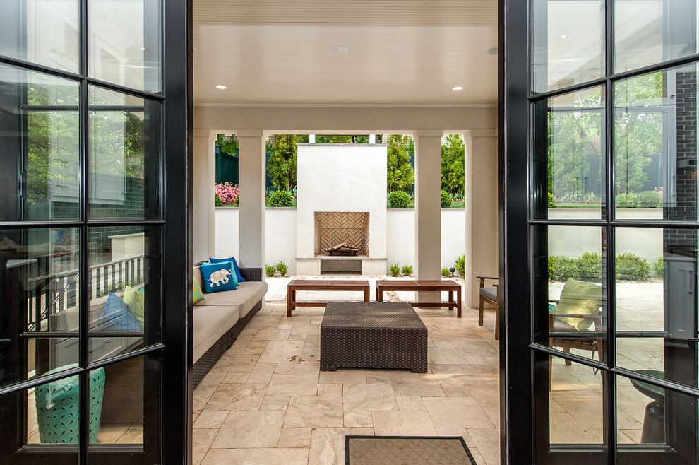 Photo of a medium sized contemporary back patio in DC Metro with tiled flooring and a roof extension.