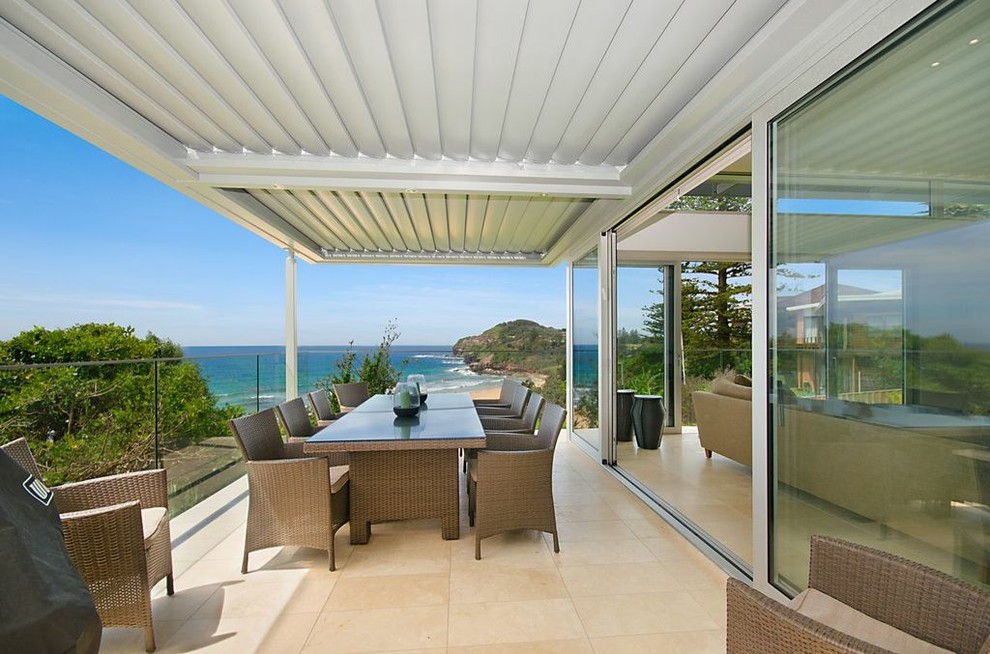 Design ideas for a contemporary back patio in Sydney with a pergola.