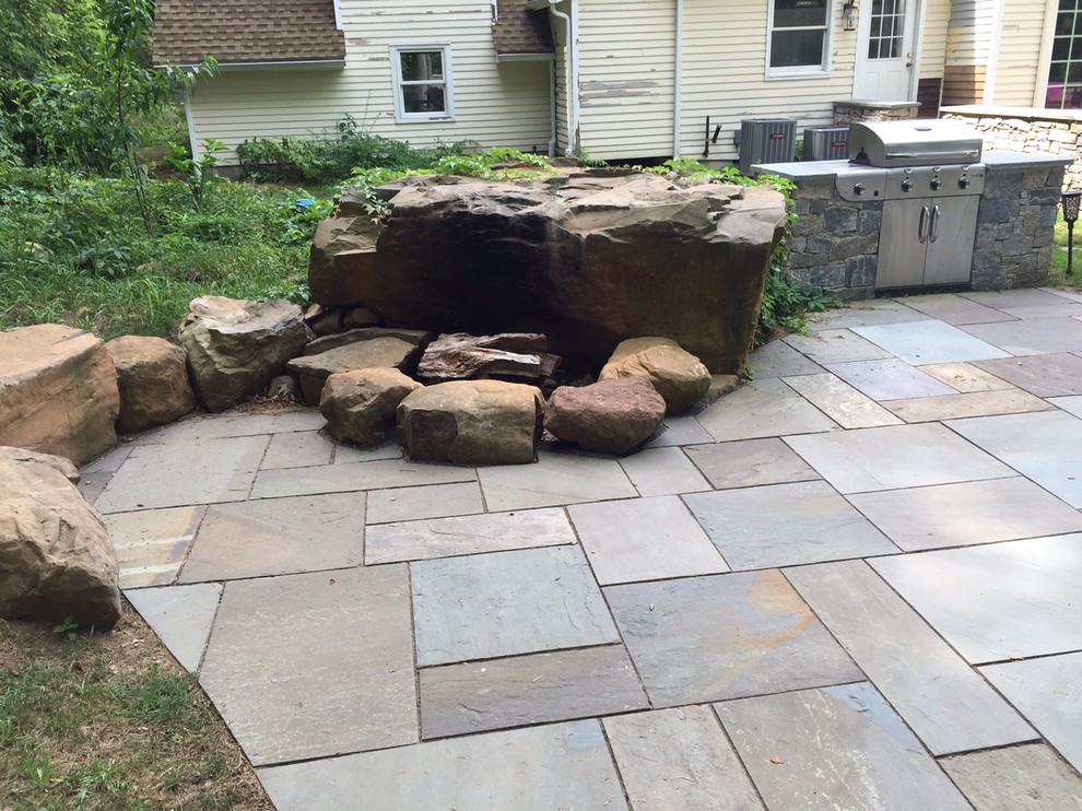 Inspiration for a traditional back patio in Boston with an outdoor kitchen.