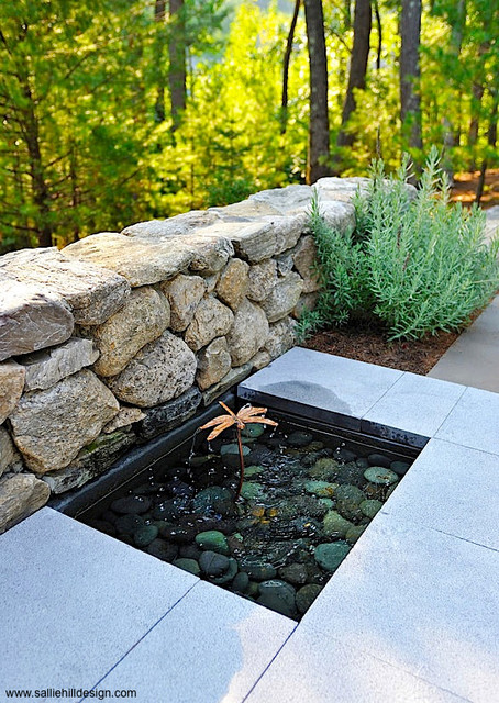 Bluestone patio dragonfly bubbler inset water feature with river stones ...